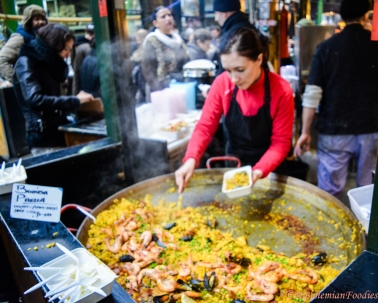 A popular stall cooking and selling sea food paella (a Spanish rice-based specialty)